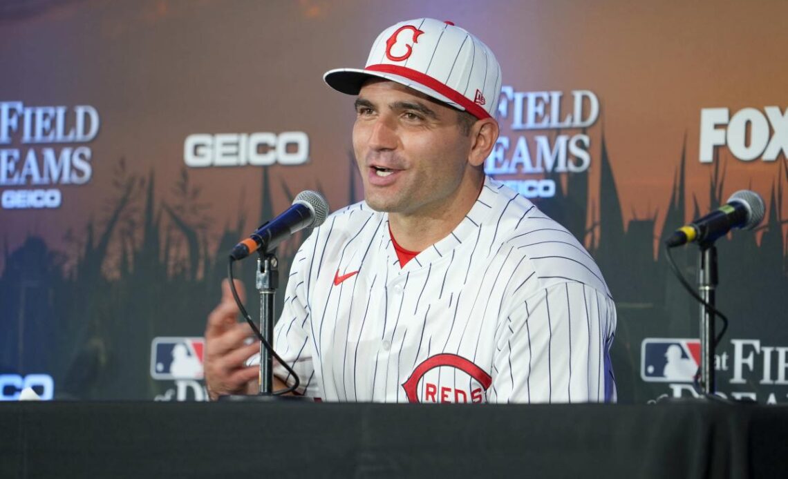 Injured Reds star Joey Votto spends time with fans in the stands during game vs. Red Sox