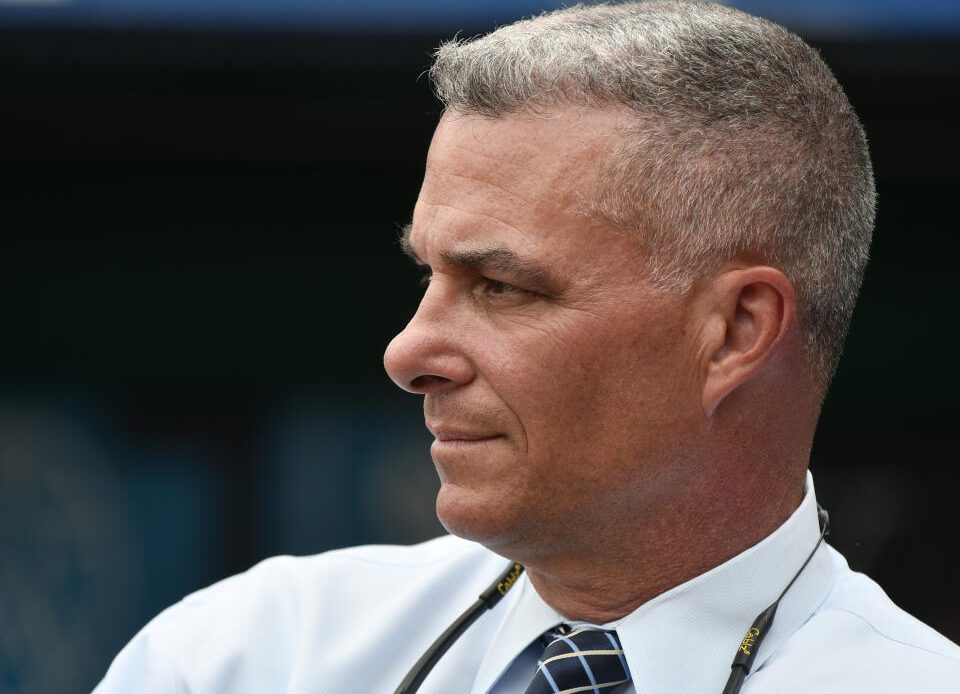 KANSAS CITY, MO - JUNE 12: Dayton Moore general manager of the Kansas City Royals watches batting practice prior to a game against the Cincinnati Reds at Kauffman Stadium on June 12, 2018 in Kansas City, Missouri. (Photo by Ed Zurga/Getty Images)