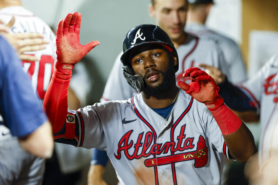 Sep 9, 2022; Seattle, Washington, USA; Atlanta Braves center fielder Michael Harris II (23) high-fives teammates in the dugout after hitting a solo-home run against the Seattle Mariners during the sixth inning at T-Mobile Park. Mandatory Credit: Joe Nicholson-USA TODAY Sports