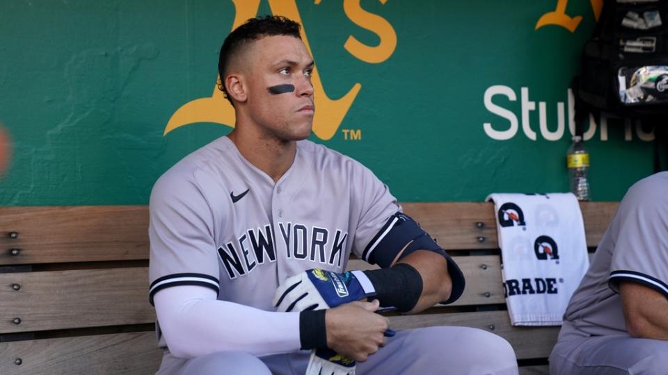 Aaron Judge sitting alone dugout road greys Oakland