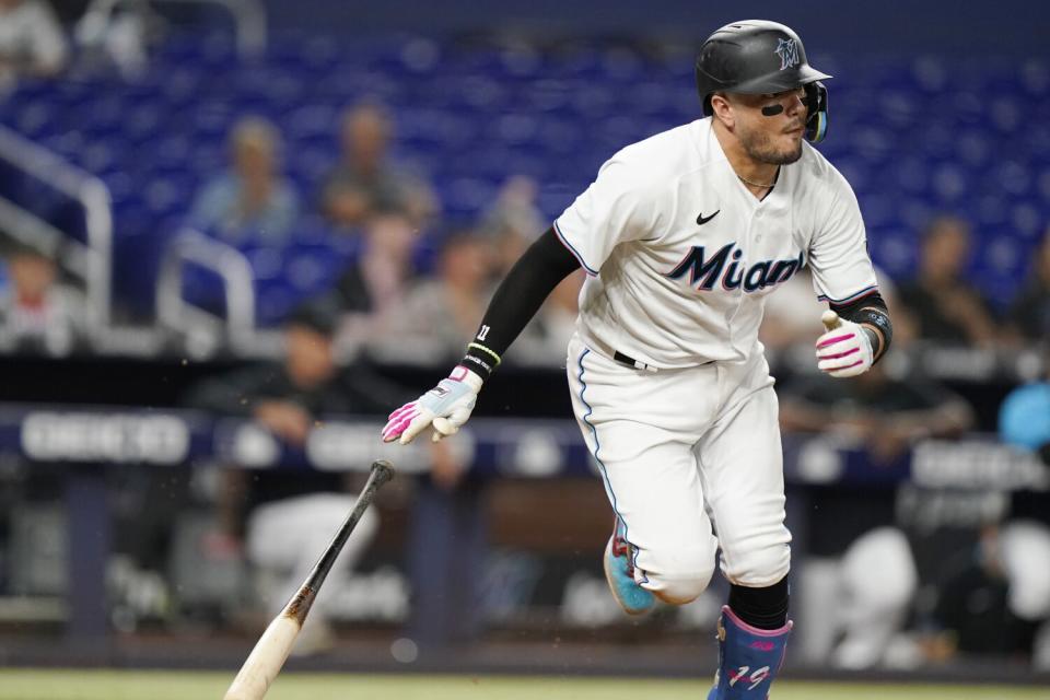 Miami Marlins' Miguel Rojas runs after hitting a single during the third inning against the Philadelphia Phillies.