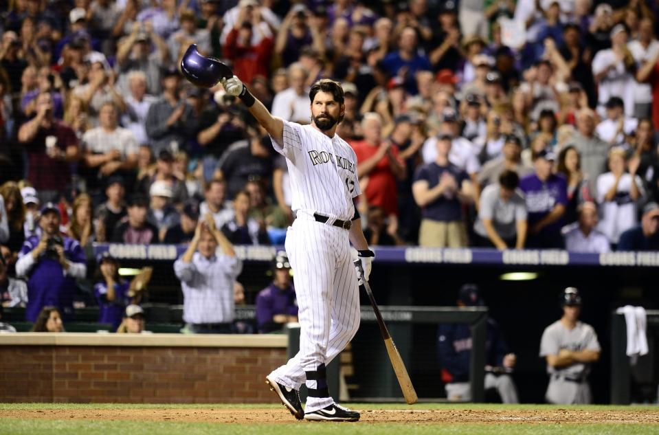 Rockies first baseman Todd Helton tips his cap to the fans at Coors Field in the final game of his career on Sept. 25, 2013, against the Boston Red Sox.