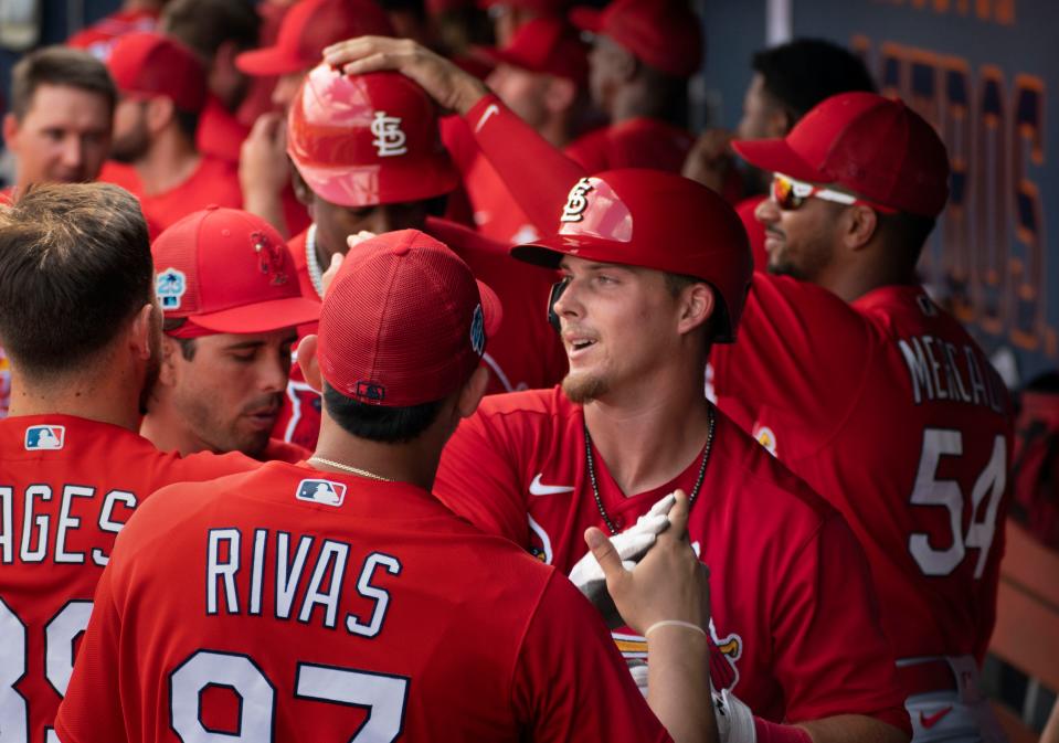 St. Louis Cardinals Nolan Gorman is congratualed by teammates after hitting a two-run homer against the Washington Nationals spring training game at the Ballpark of the Palm Beaches in West Palm Beach, Florida on March 4, 2023.