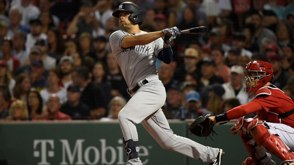 Aug 13, 2022; Boston, Massachusetts, USA; New York Yankees shortstop Isiah Kiner-Falefa (12) hits a two-run home run during the fifth inning against the Boston Red Sox at Fenway Park.