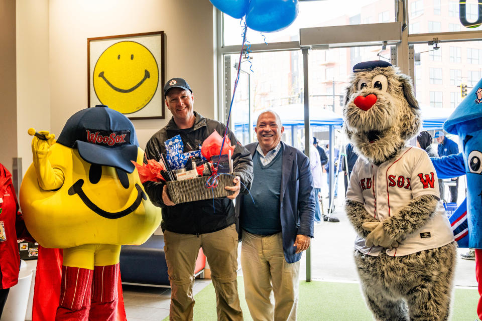 WooSox President Dr. Charles Steinberg, second from right, presented the One Millionth Fan in WooSox history to Hubbarstron's Matt Gingras, second from right. Gingras received a prize package of WooSox goodies that were presented by WooSox mascots Smiley Ball and Woofster.