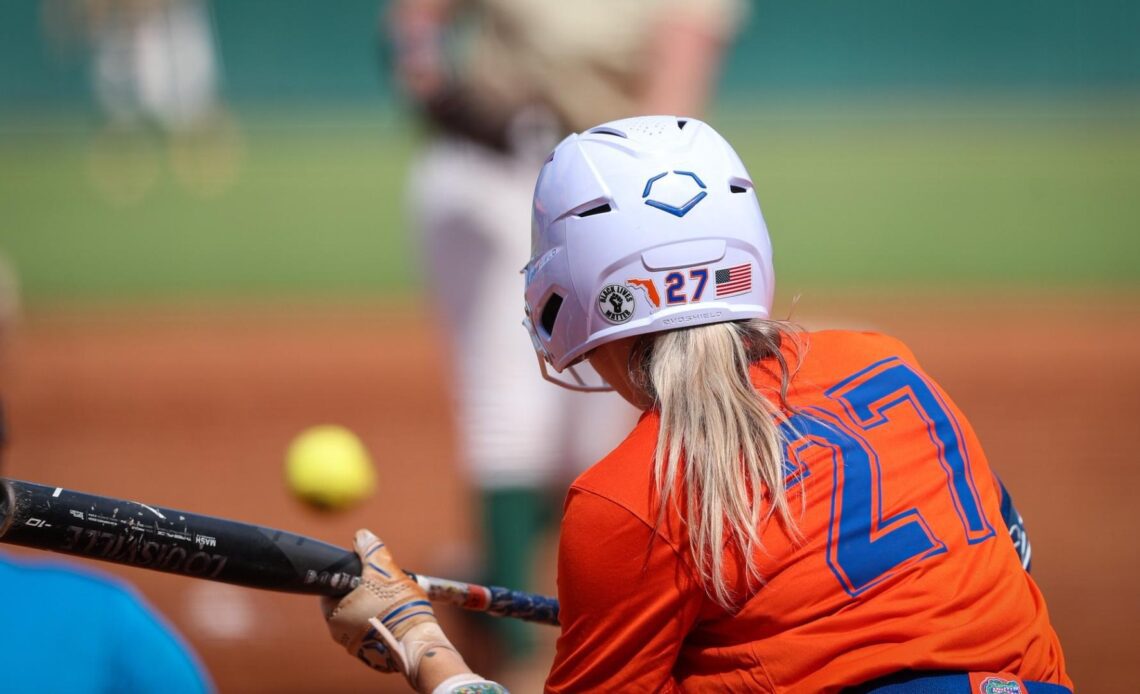 Gators Cruise by Dolphins in Softball Exhibition