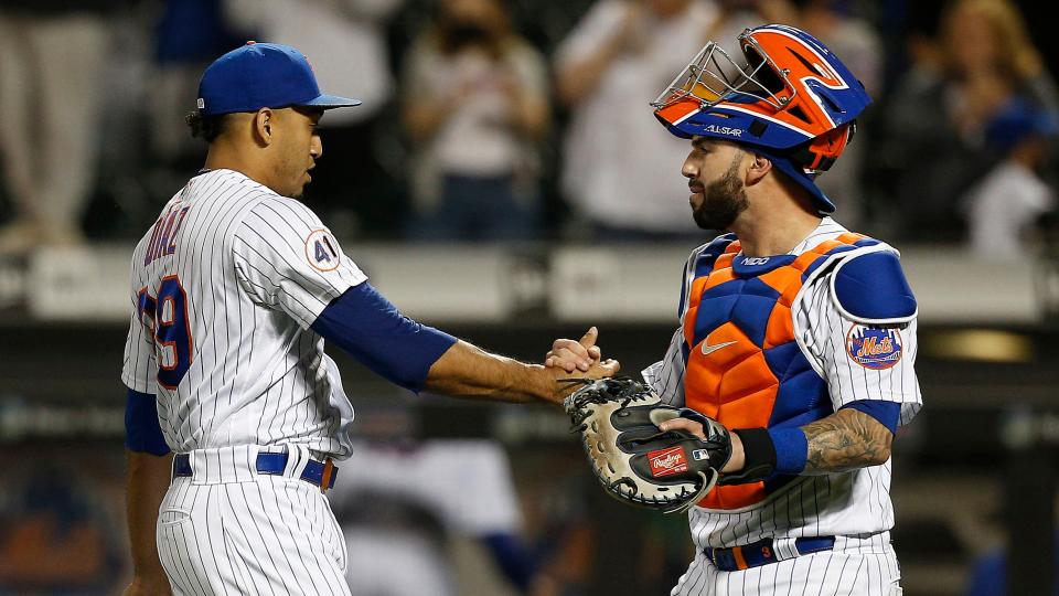 May 25, 2021; New York City, New York, USA; New York Mets relief pitcher Edwin Diaz (left) and catcher Tomas Nido (right) celebrate on the field after defeating the Colorado Rockies at Citi Field.