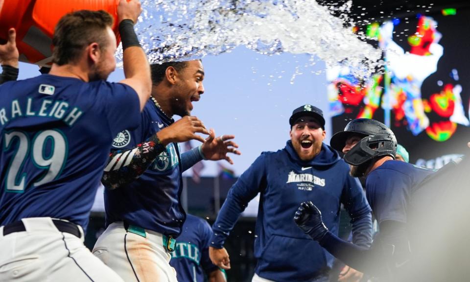 <span>The Mariners celebrate an extra inning victory over the <a class="link " href="https://sports.yahoo.com/mlb/teams/chi-white-sox/" data-i13n="sec:content-canvas;subsec:anchor_text;elm:context_link" data-ylk="slk:White Sox;sec:content-canvas;subsec:anchor_text;elm:context_link;itc:0">White Sox</a> earlier this season.</span><span>Photograph: Lindsey Wasson/AP</span>