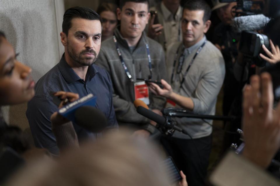 Dodgers general manager Brandon Gomes meets with reporters during MLB's winter meetings in Nashville, Tenn.