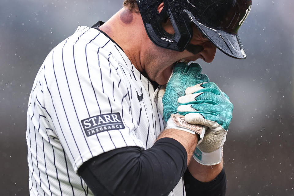 Anthony Rizzo #48 bites his hand after being hit by a pitch during the seventh inning of the game against the Pittsburgh Pirates. (Dustin Satloff/Getty Images)