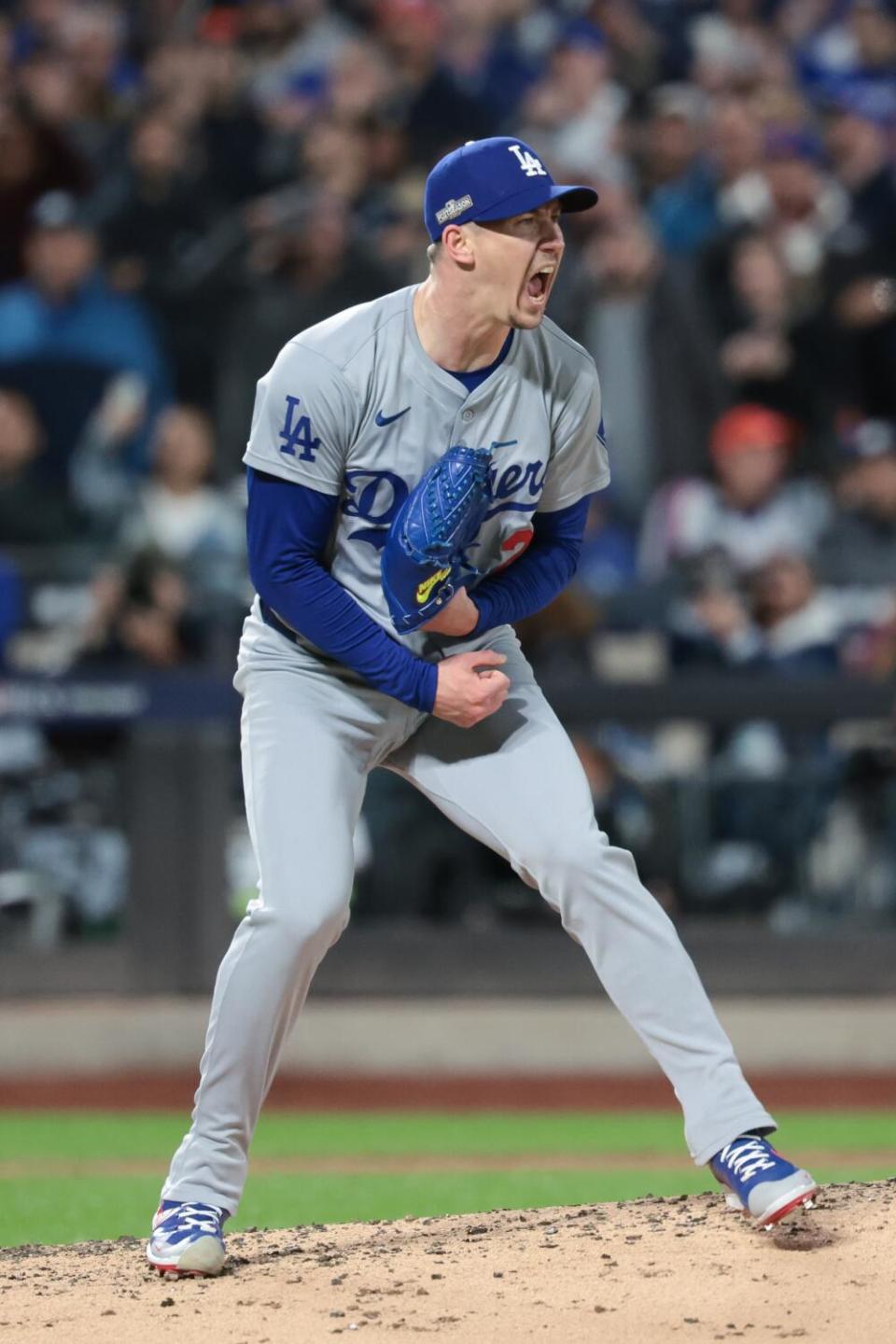 Walker Buehler celebrates after striking out New York's Francisco Lindor to get out of a bases-loaded jam.