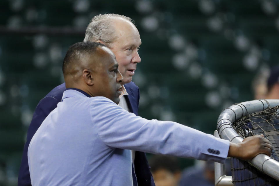 Houston Astros general manager Dana Brown, left, and owner Jim Crane, right, watch batting practice before a baseball game against the Seattle Mariners Tuesday, Sept. 24, 2024, in Houston. (AP Photo/Michael Wyke)