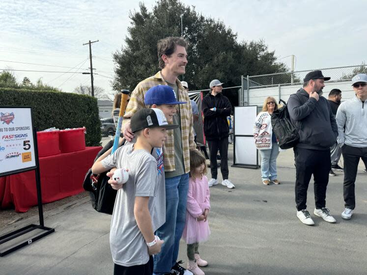 New York Yankees pitcher Max Fried takes photo with Altadena Little League players during event sponsored by his foundation.