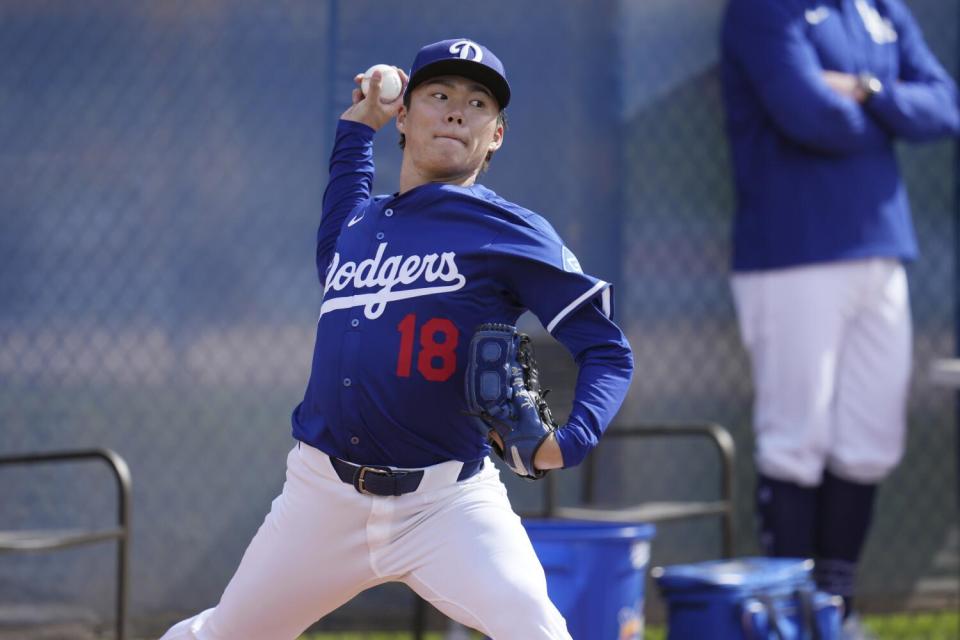 Yoshinobu Yamamoto throws during a workout at Camelback Ranch on Tuesday.