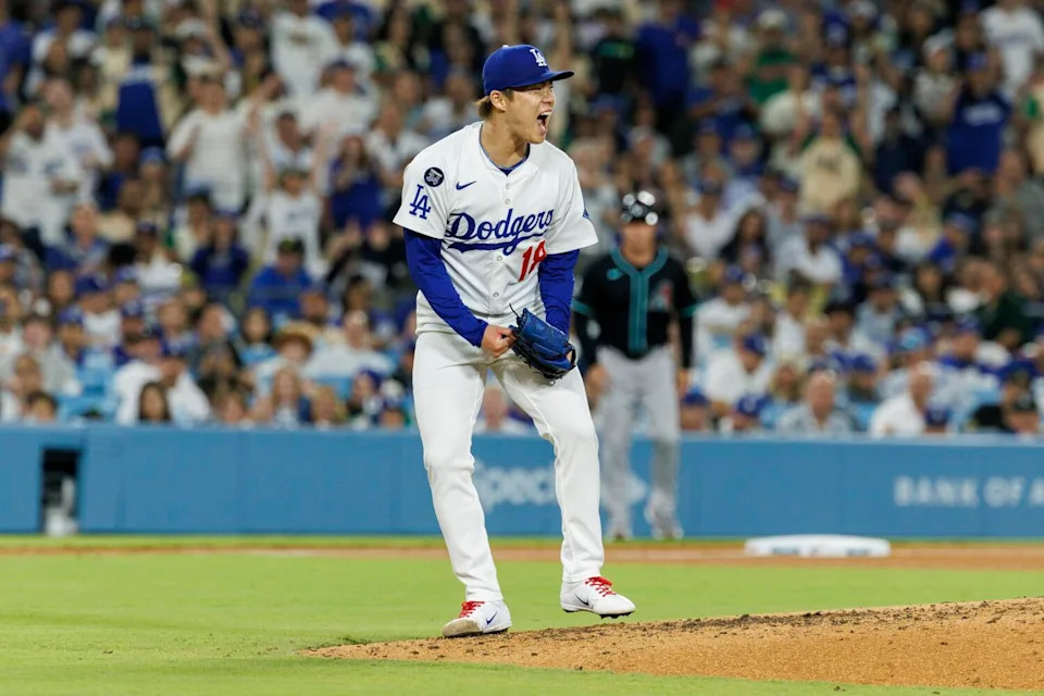 Yoshinobu Yamamoto cheers.