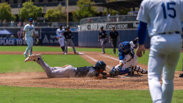 Tulsa Drillers catcher Nelson Quiroz attempts to tag out a San Antonio runner